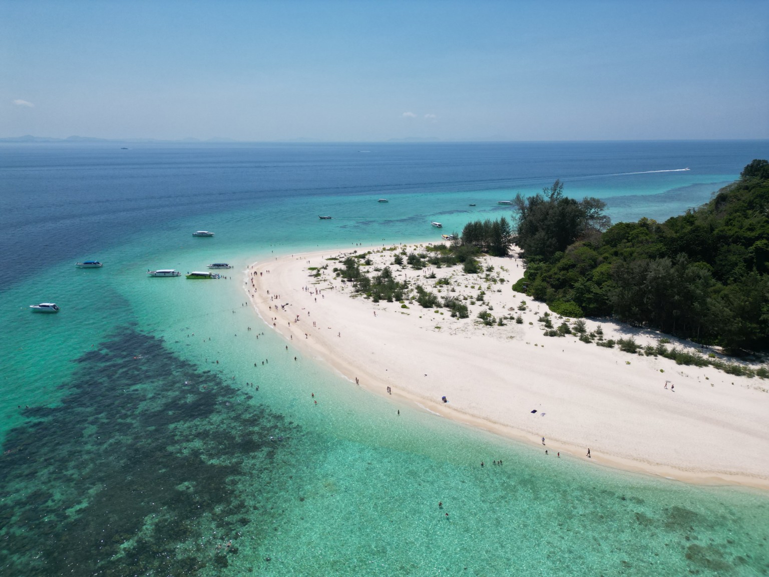 Bamboo Island white-sand beach and clear turquoise sea, photographed by Phuket Island Charters