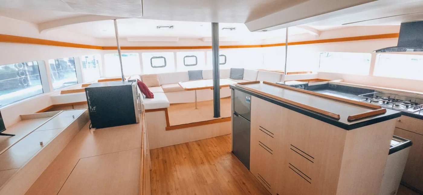Interior saloon and seating area aboard the Catalante.